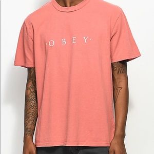 Salmon colored obey shirt